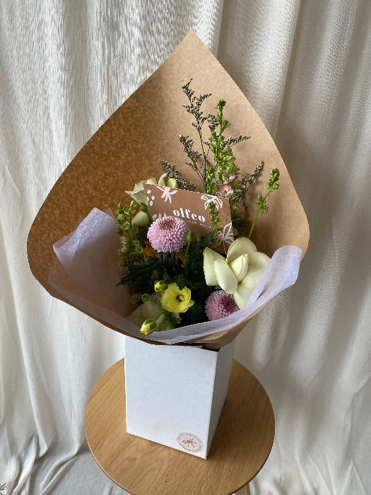 pink yellow and white flower bouquet for delivery in white box
