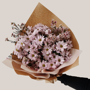 Light pink spray mums bouquet wrapped in kraft paper mixed with wax flower. Large size.
