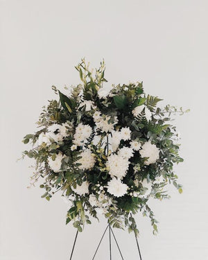 Green and White floral funeral wreath with stand