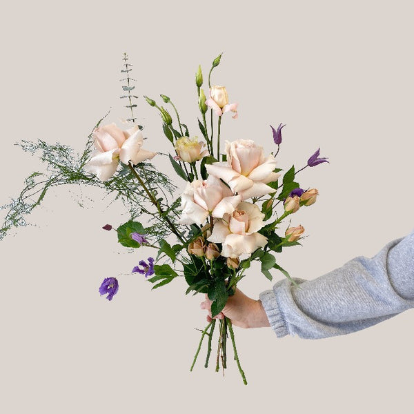 Mixed bouquet, sesonal fresh flowers with pasted roses, lisianthus, spray roses and light greenery