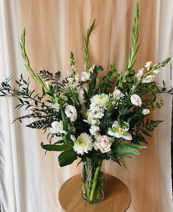 Extra large white and green funeral arrangement